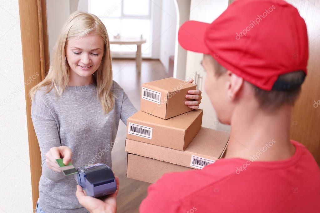 woman paying for package 