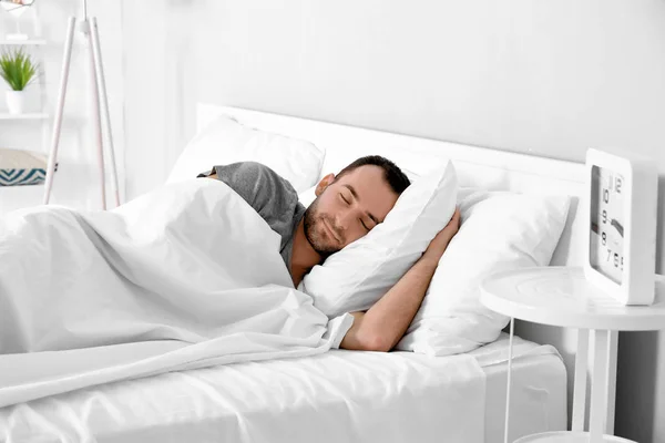 man sleeping in bed