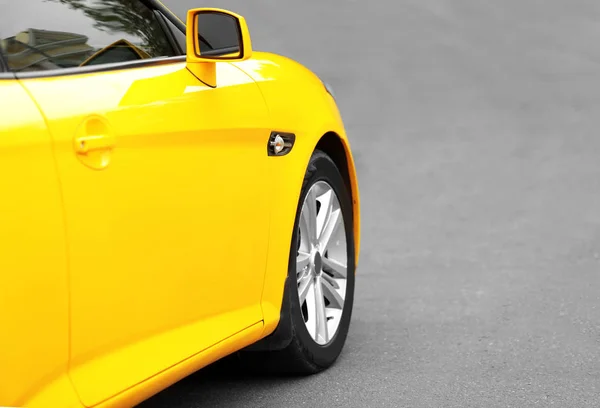 Closeup of yellow car on the road — Stock Photo, Image