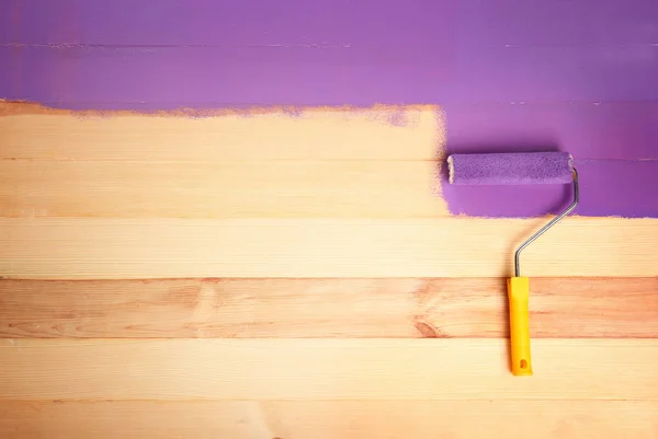 Painting roller with purple paint — Stock Photo, Image