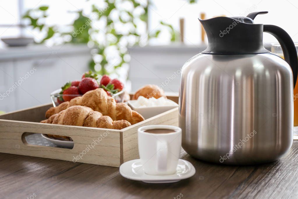 Breakfast with strawberries and coffee on wooden table