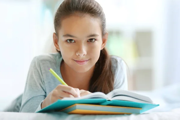 Cute girl doing lessons — Stock Photo, Image