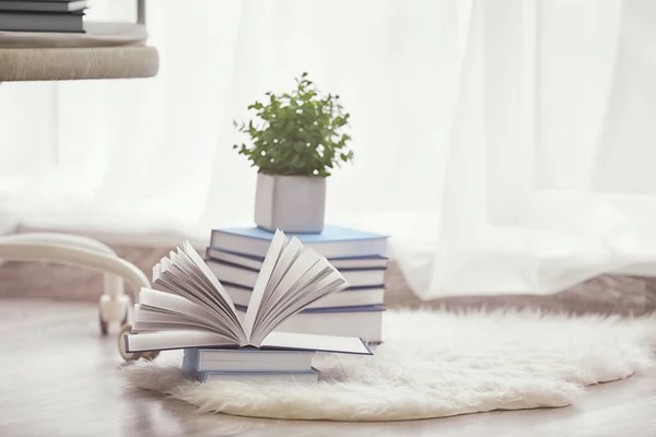 Pile of books on carpet — Stock Photo, Image