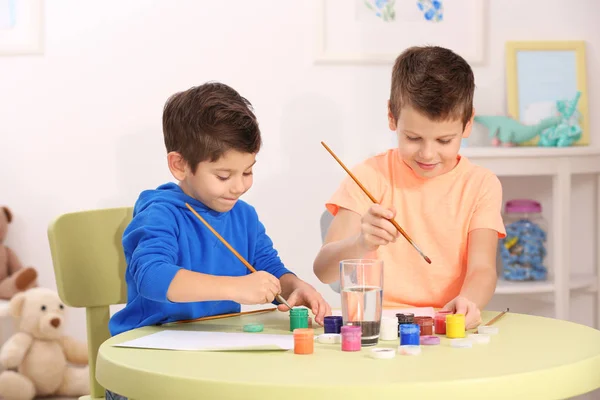Cute little boys drawing pictures — Stock Photo, Image