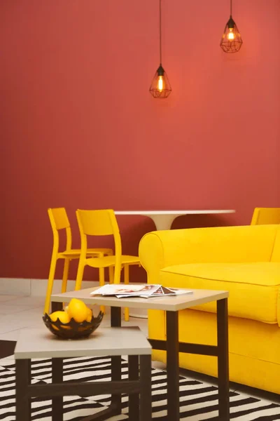 room interior with yellow sofa