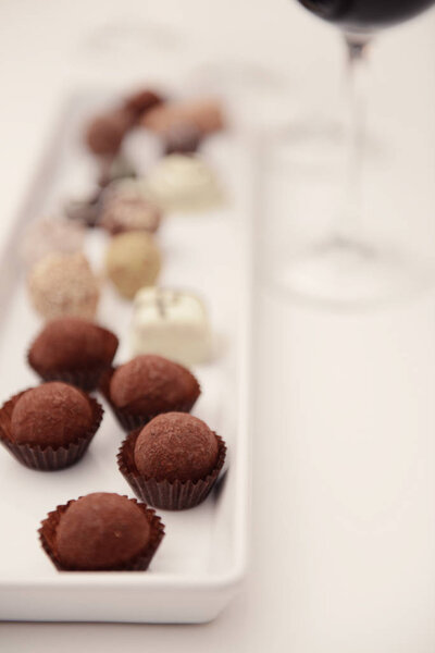 Delicious chocolates on white table