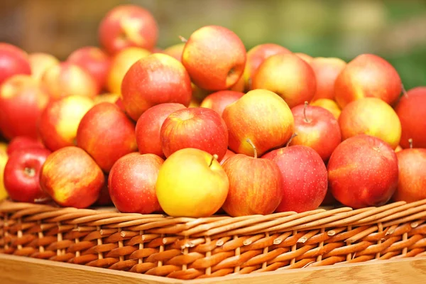 Wicker basket with apples — Stock Photo, Image