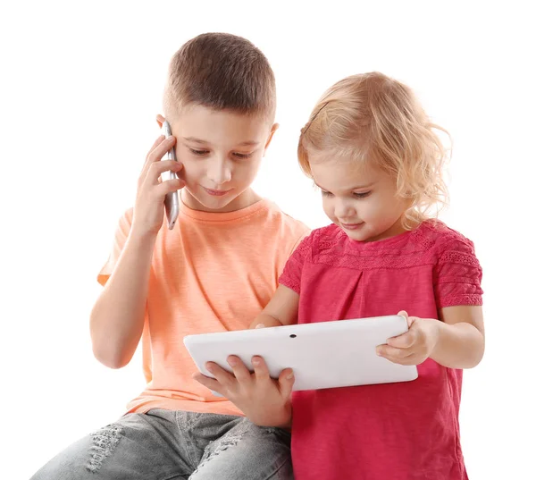 Little brother and sister with gadgets — Stock Photo, Image