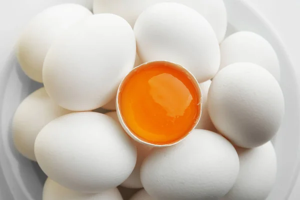 Raw eggs and yolk — Stock Photo, Image