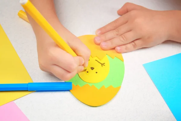 Child making Easter application — Stock Photo, Image