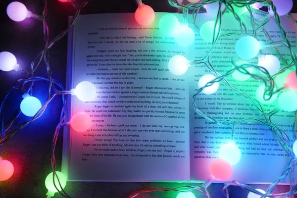 Book and beautiful garland — Stock Photo, Image