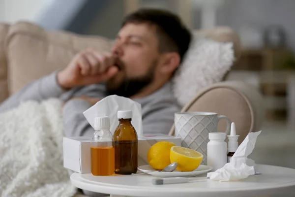 Medicines with electronic thermometer and lemons — Stock Photo, Image