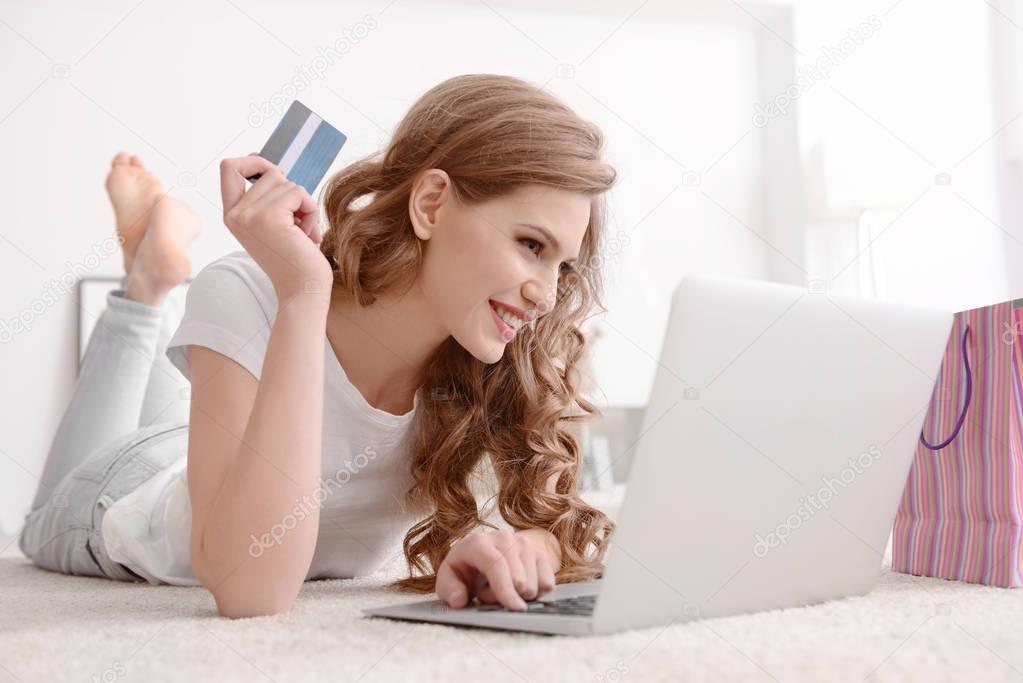 Young woman shopping online  