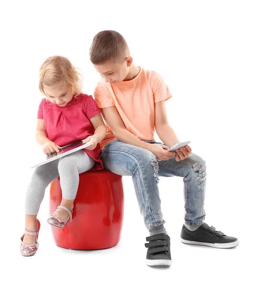 Little brother and sister with gadgets — Stock Photo, Image