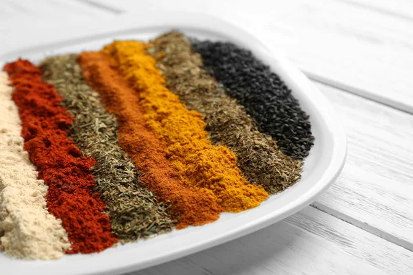 Plate with mix of different spices — Stock Photo, Image