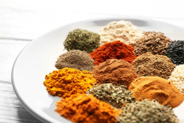 Plate with mix of different spices — Stock Photo, Image