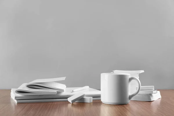 Blank goods on wooden table — Stock Photo, Image