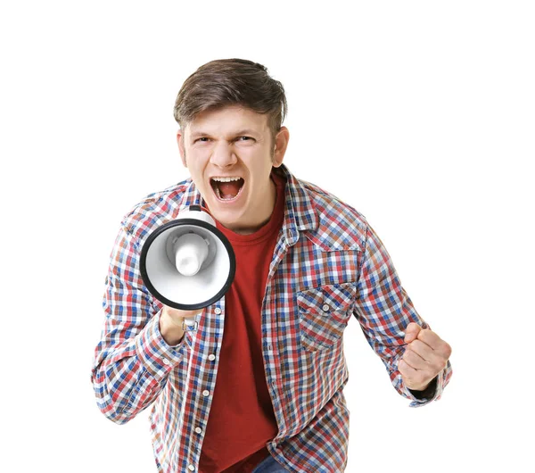 Protestando jovem gritando em megafone no fundo de luz — Fotografia de Stock