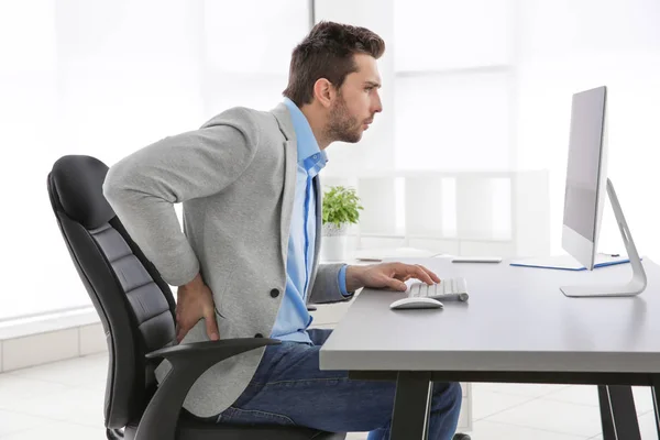 Incorrect posture concept. Man sitting at office table — Stock Image Incorrect posture concept. Man sitting at office table Stock Picture