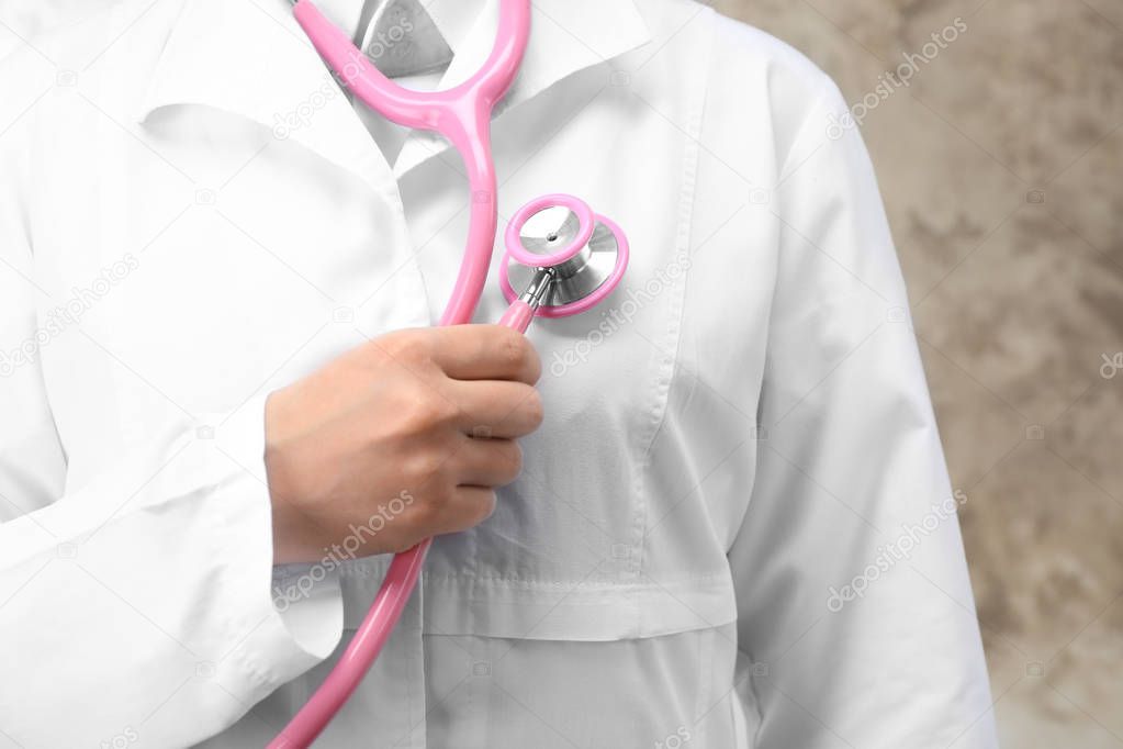 Doctor holding stethoscope, closeup