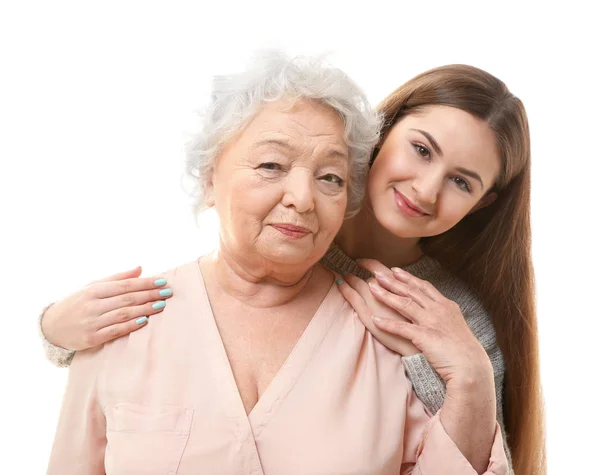 Schönes Mädchen mit Großmutter auf weißem Hintergrund — Stockfoto