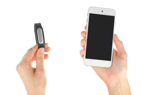 Mani con cardiofrequenzimetro e smartphone — Foto Stock