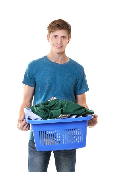 Glücklicher Mann hält Plastikbox mit Kleidung auf weißem Hintergrund — Stockfoto