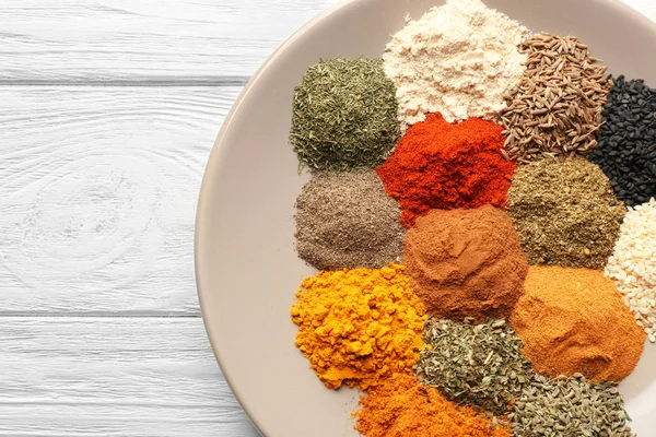 Plate with mix of different spices — Stock Photo, Image