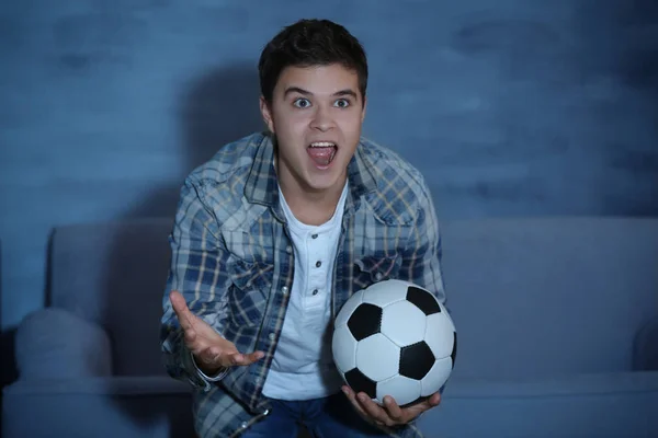 Teenager watching football match — Stock Photo, Image