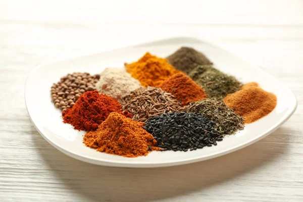Plate with mix of different spices — Stock Photo, Image