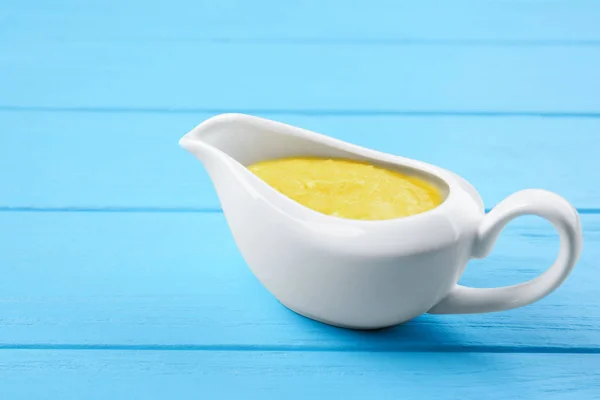 Gravy boat with cheese sauce — Stock Photo, Image