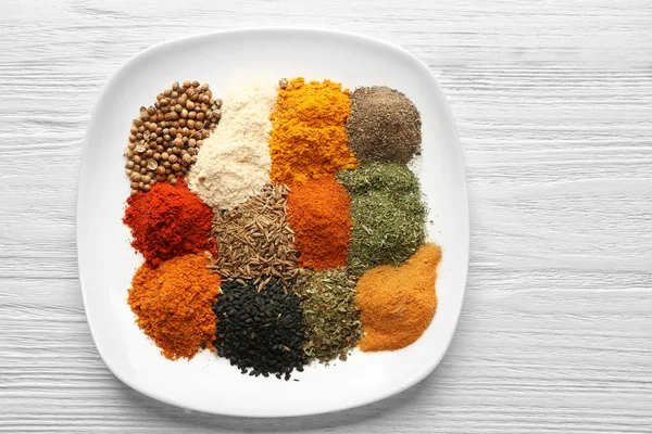 Plate with mix of different spices — Stock Photo, Image