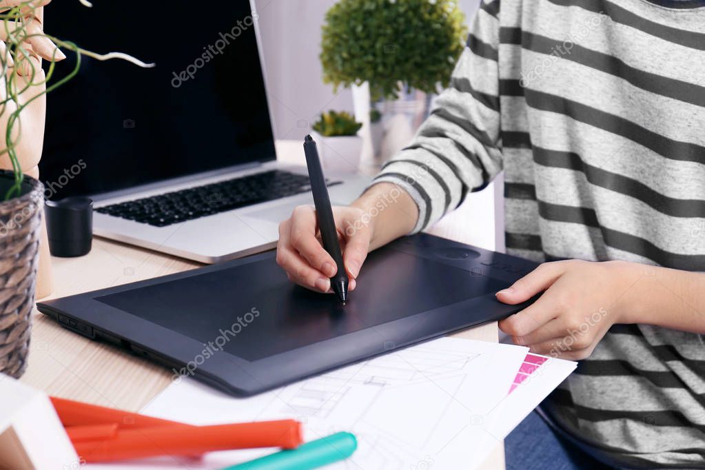 Designer drawing on graphic tablet