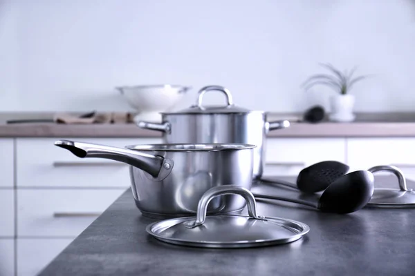 Metal pans in kitchen — Stock Photo, Image