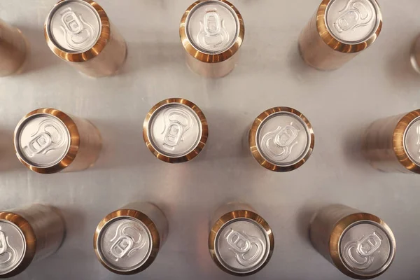 Cans of beer on table