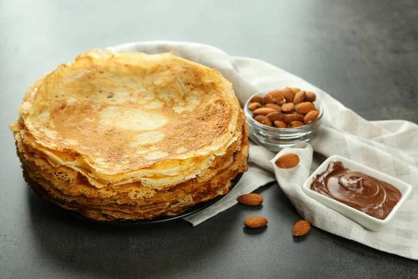 Delicious pancakes, almonds and chocolate — Stock Photo, Image