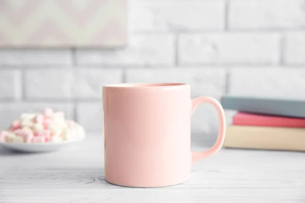 Cup on white table — Stock Photo, Image