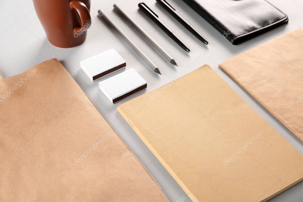 Flat lay of blank beige and white goods on table