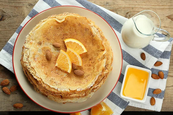 Stack of delicious pancakes with orange — Stock Photo, Image