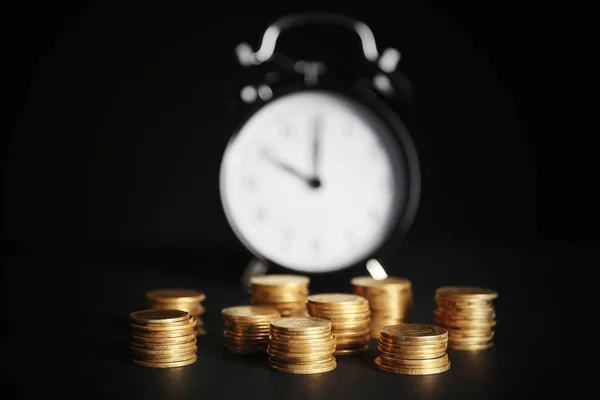 Coins and alarm clock — Stock Photo, Image