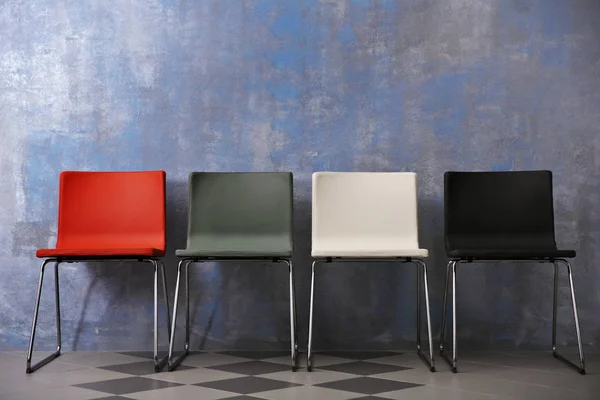 Chairs near grey wall — Stock Photo, Image