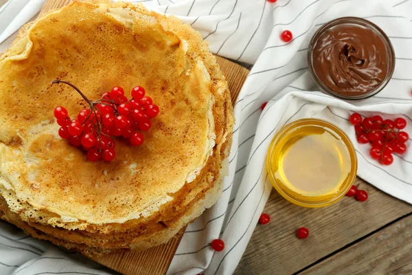 Pancakes decorated with viburnum — Stock Photo, Image