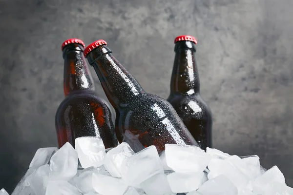 Bottles of beer in ice — Stock Photo, Image
