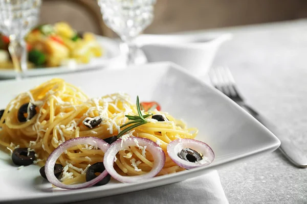 Plate of pasta salad with olives