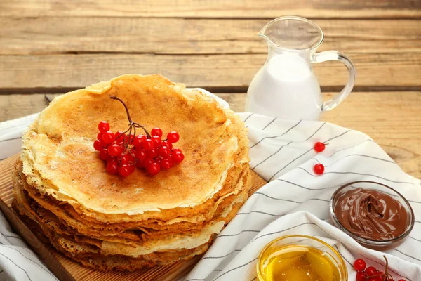 Pancakes decorated with viburnum — Stock Photo, Image