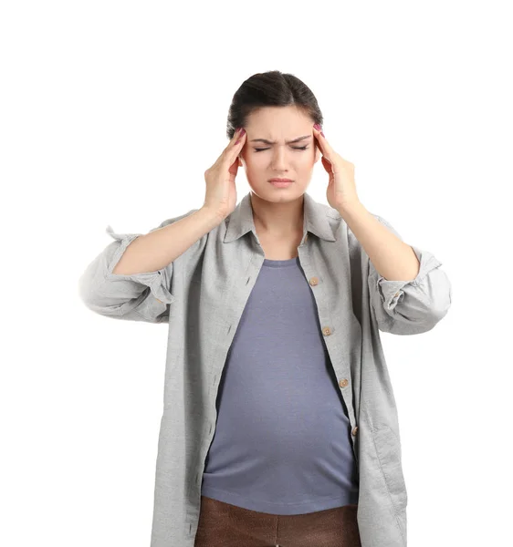 Mladá těhotná žena trpí bolestí hlavy na bílém pozadí — Stock fotografie