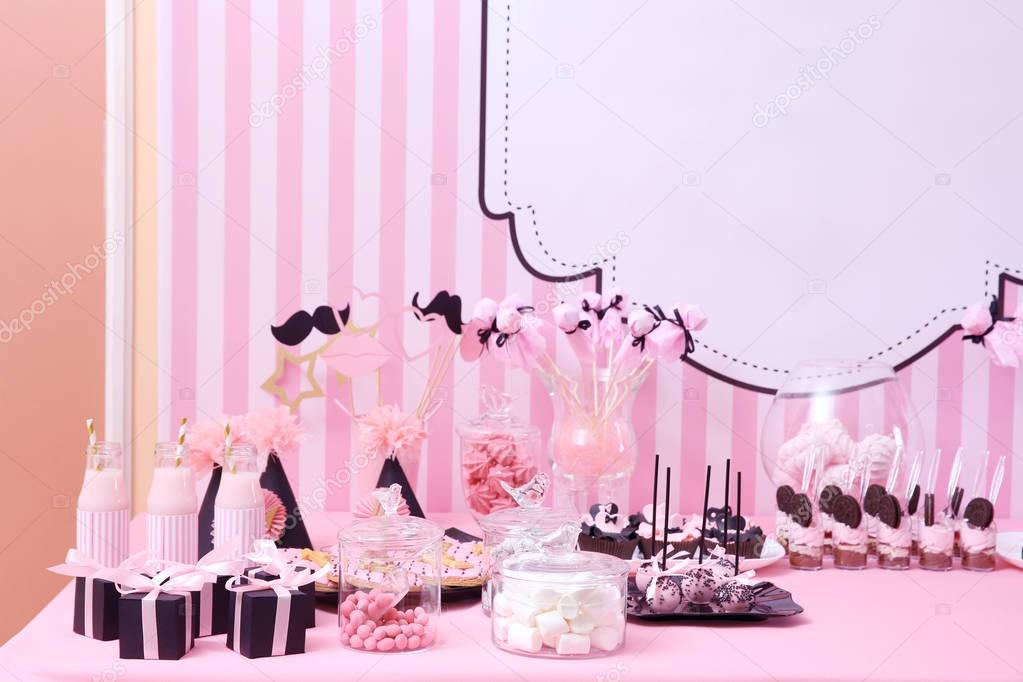 Table with tasty sweets
