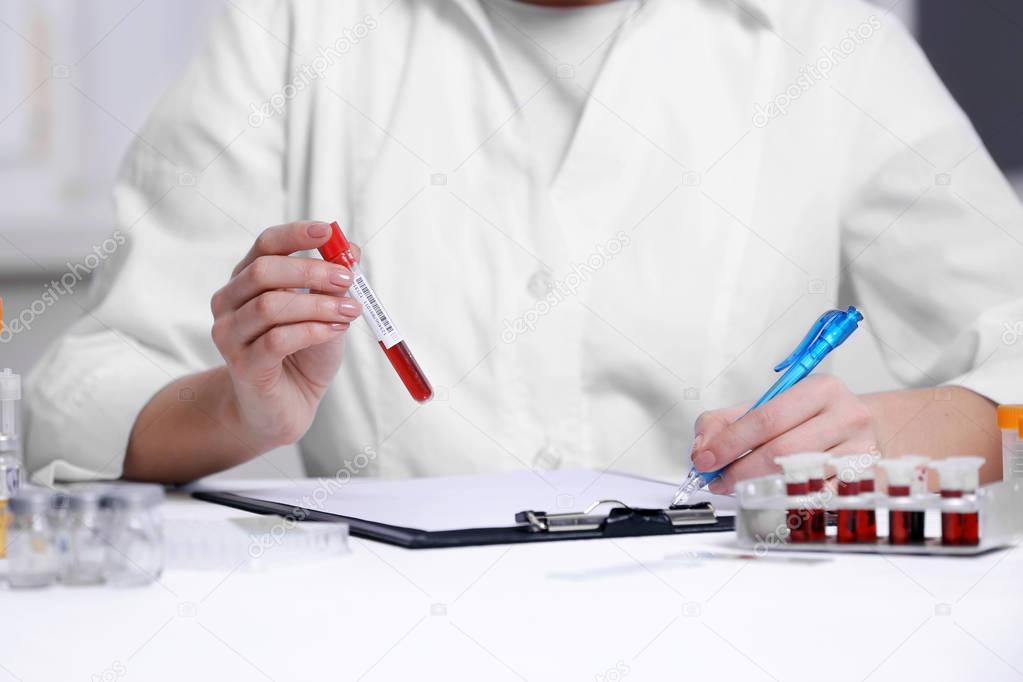 Woman working with blood samples 