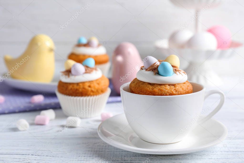 Delicious cupcake in cup 