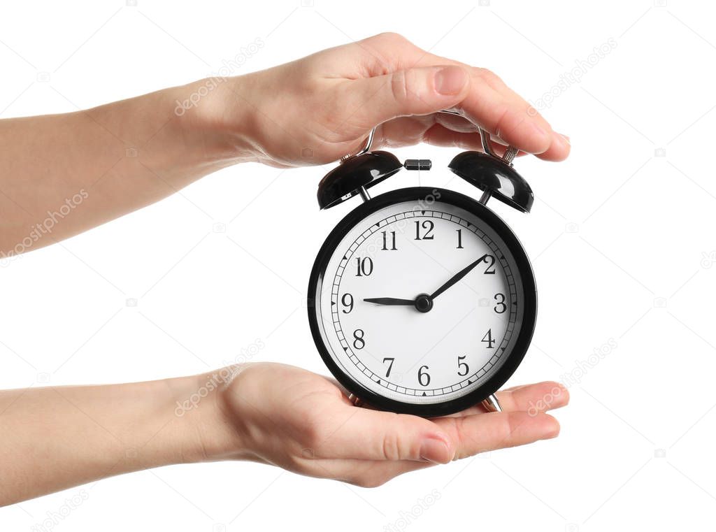 hands holding alarm clock